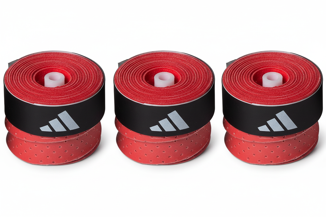 Three red Adidas grip tape stacks side by side